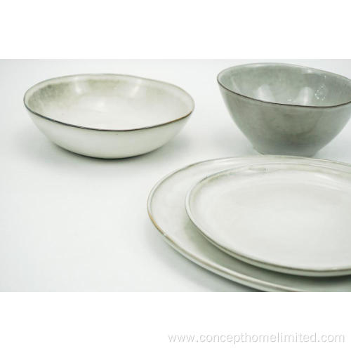 Reactive glazed stoneware dinner set in light grey